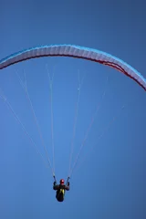 Fototapeten Paraglider on Blue Sky © Benjamin Sibuet