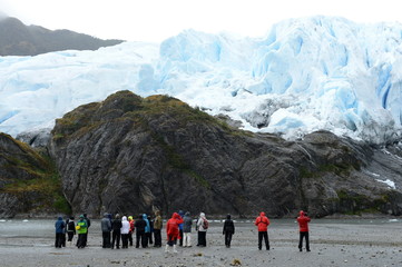 Tourists at the foot of the Aguila glacier. Tierra Del Fuego