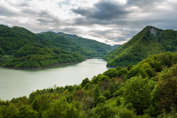 Fototapeta na wymiar Dam lake between mountains