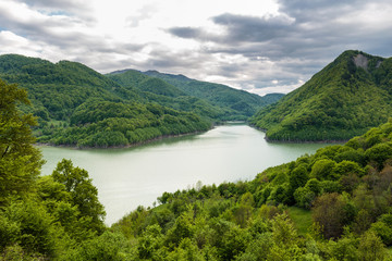 Obraz na płótnie Canvas Dam lake between mountains