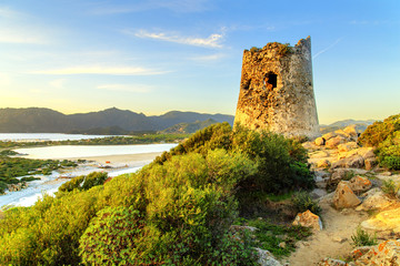 Susnet over old tower with a panoramic view of Villasimius, Sardinia