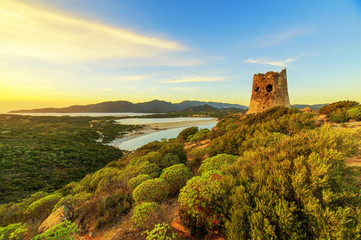 Susnet over old tower with a panoramic view of Villasimius, Sardinia
