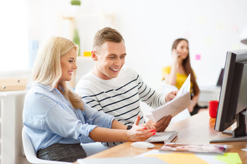 Positive colleagues sitting at the table      