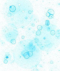 Abstract watercolor blue stain background with blue soap round bubbles and splash. Many macro blue circles and dots. Blue soapy bubbles. Background for cleaning service. Wash, washing.