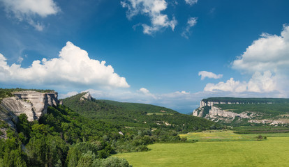 Mountain valley with field. Natural summer landscape..