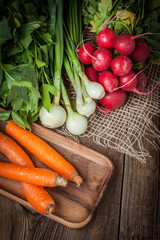 Fresh vegetables on a wooden table.
