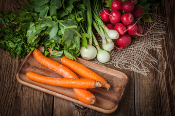 Fresh vegetables on a wooden table.