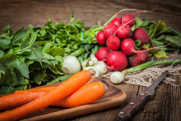 Fresh vegetables on a wooden table.