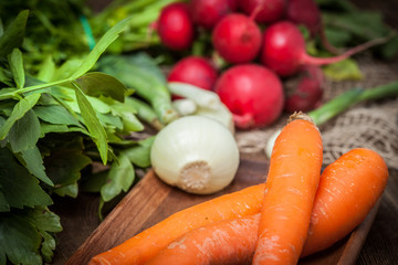 Fresh vegetables on a wooden table.
