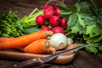 Fresh vegetables on a wooden table.