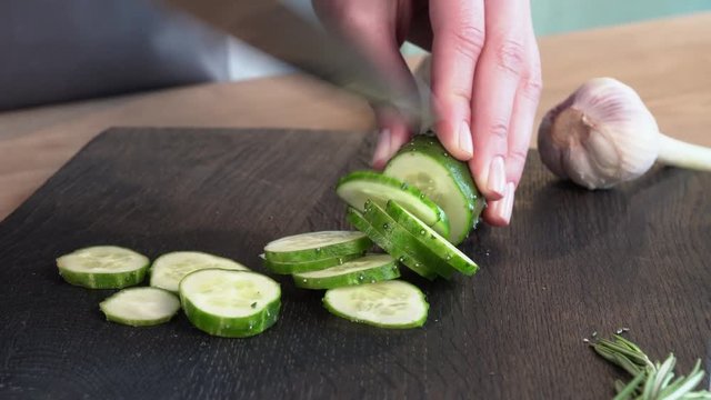 knife cut cucumber on the table