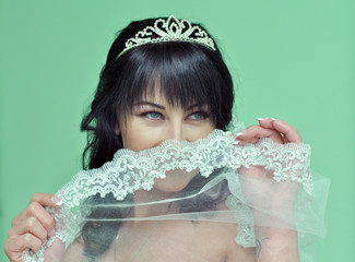 Bride looking through veil