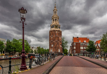 Montelbaanstoren tower under cloudy sky in Amsterdam, Netherland
