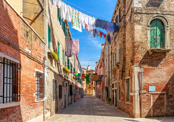 Fototapeta premium Old colorful houses and small street in venice.
