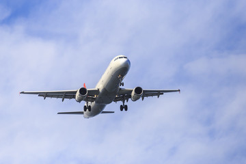 an airplane low pass during the morning with blue sky and elegant view