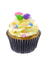 yellow icing on cupcake