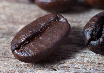 coffee grains on grunge wooden background