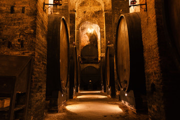 cellar with barrels for storage of wine, Italy