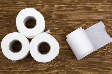 Toilet paper on wooden board
