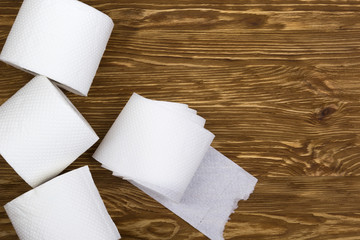 Toilet paper on wooden board