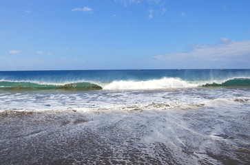 Blue sea with waves and sky with clouds for background or texture