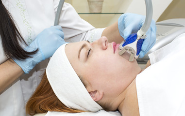 woman is in the process at the clinic lipomassage