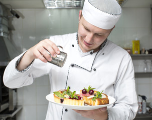 chef preparing food in the kitchen at the restaurant