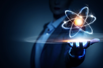 Atom molecule in female hand