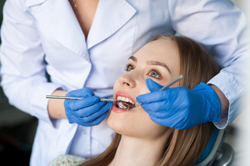 Fototapeta premium Dentist examining a patient's teeth