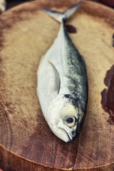 Horse mackerel on a chopping board