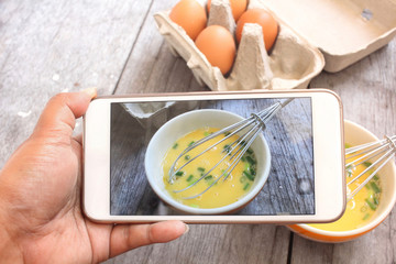 Take photo of eggs in box and bowl with smart phone