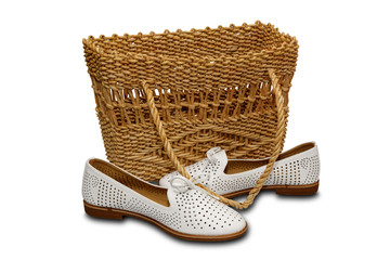 Accessories. Wicker basket and women's summer shoes white color.