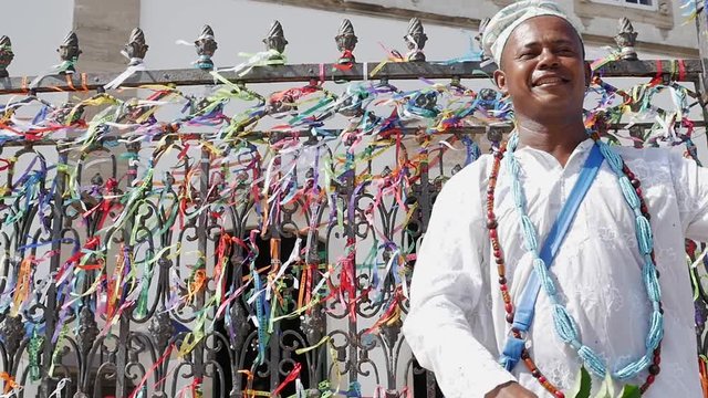 Brazilian man wearing traditional clothes at Bonfim Church in Salvador, Bahia, Brazil