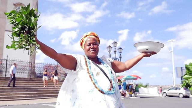 Brazilian woman wearing traditional clothes at Bonfim Church in Salvador, Bahia, Brazil