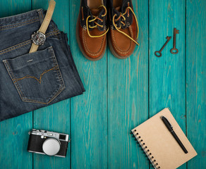 Travel concept - shoes, jeans, notepad, camera, watch and vintag