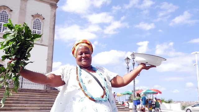 Brazilian woman wearing traditional clothes at Bonfim Church in Salvador, Bahia, Brazil