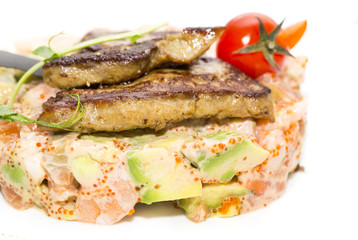 salad, fish and eggs decorated with greens and tomatoes