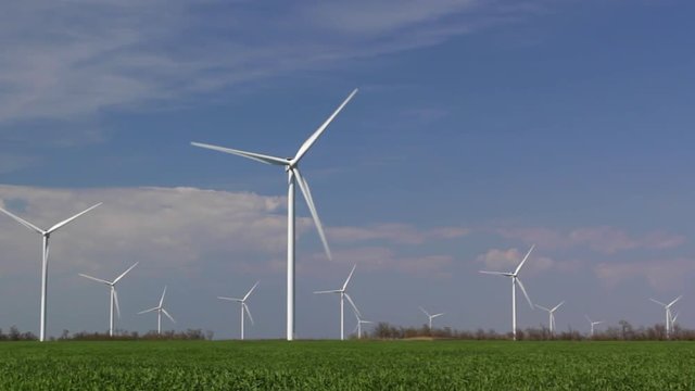  wind turbines against blue sky