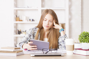 Caucasian female using tablet