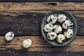 Quail eggs on wooden table
