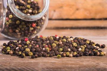 Colored pepper on a wooden background.