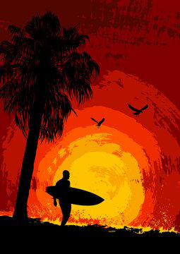 Silhouette of a surfer and palm trees at sunset