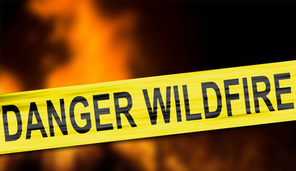 Yellow cordon tape warning of danger, wildfire