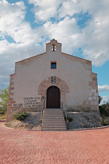 Fototapeta na wymiar Little chapel with loutish graffiti