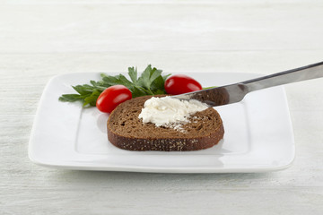 a plate with chocolate bread with a butter spread
