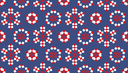 Obraz premium Decorative seamless pattern of red and white geometrical elements on blue background