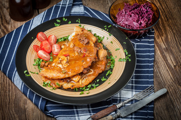 Potato pancakes with meat stew served on a plate.