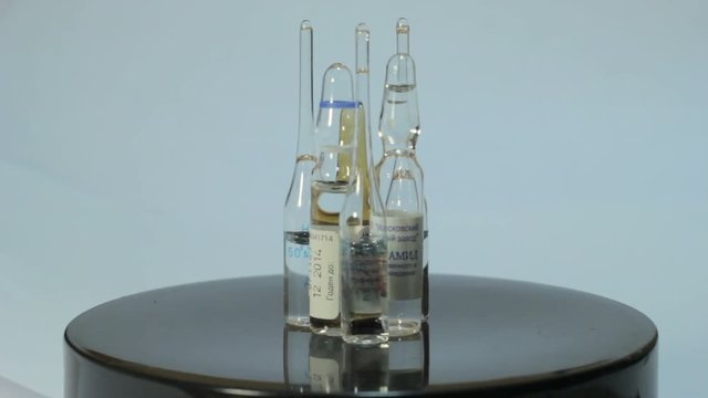 Ampoules rotate on a white background 2