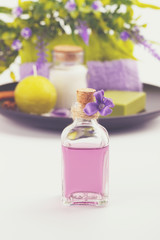 Bottle of aroma oil and Spa setting , aromatherapy and health care items,