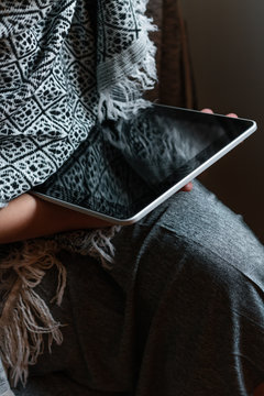 Woman using a tablet at home